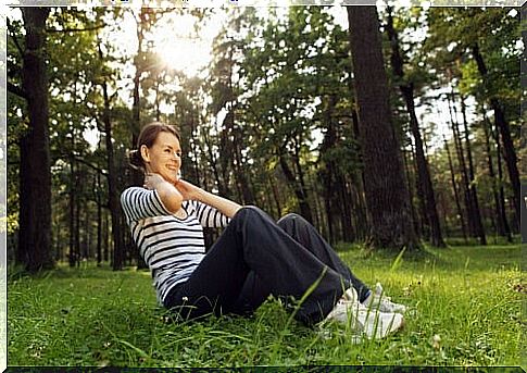 Woman exercises in the forest