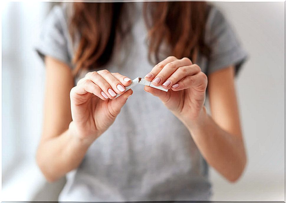 Woman breaking a cigarette