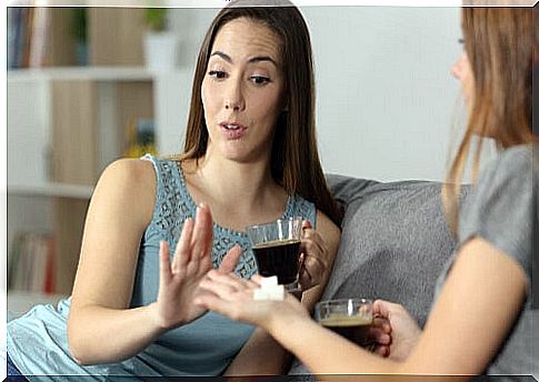 Woman refusing sugar for her coffee.