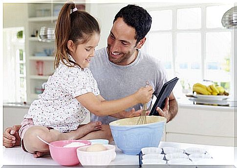 Father with his daughter teaching her to recognize emotions.