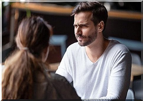 Man talking to a woman about the communication barriers