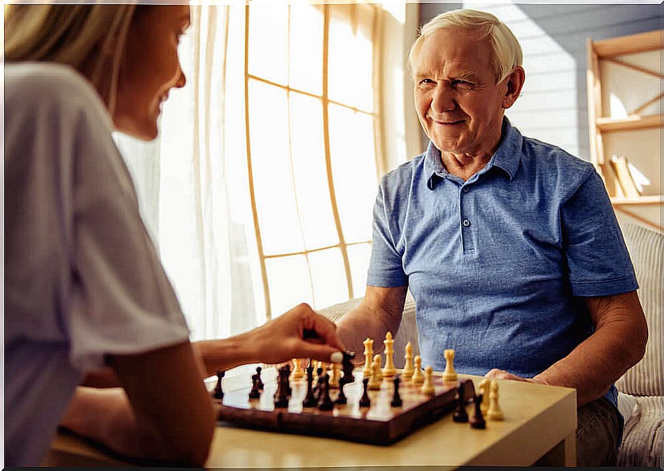 Elderly man playing chess