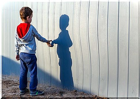 child with autism in front of a shadow